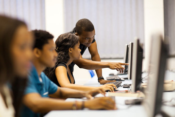 african american college students in computer room - 49197964