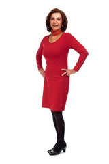 Good looking senior woman. Dressed in red. Isolated.