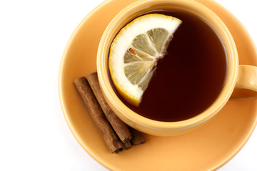 Cup of tea with lemon and cinnamon