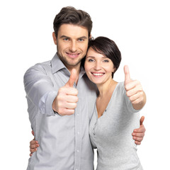 Portrait of happy couple with thumbs up sign