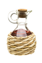 Small decanter with red wine vinegar isolated on the white