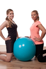 Athletic women with a pilates ball