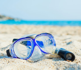 snorkel and mask on the beach.
