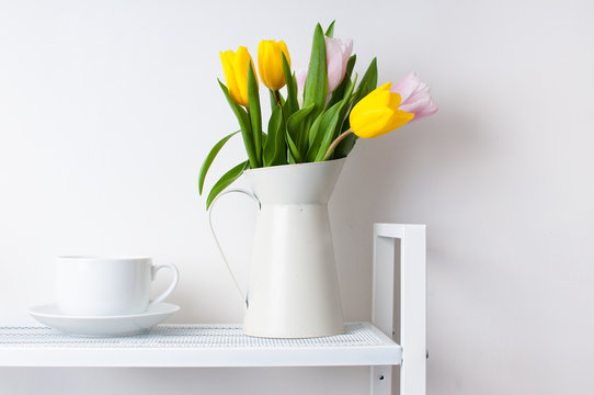 bouquet of tulips and a cup