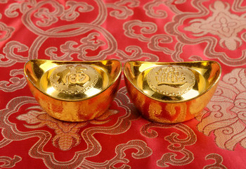 Chinese gold ingot mean symbols of wealth and prosperity.Chinese calligraphy Translation:good bless...