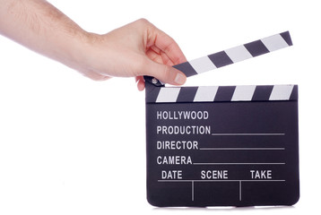 Hand holding movie clapper board cutout