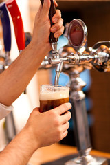 Filling glass with beer