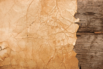 Grunge paper on wooden wall background