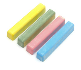 Colorful chalks over a white background.