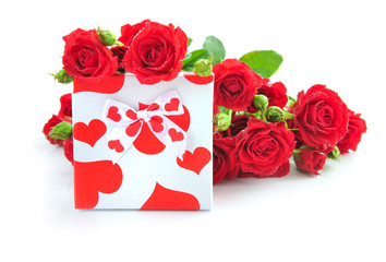 Little gift with red roses on white background