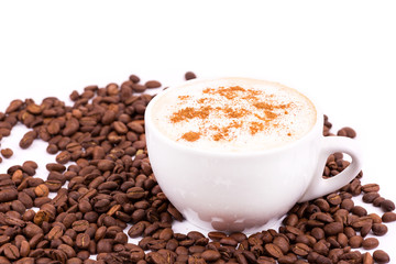 Coffee beans and cup of coffee background