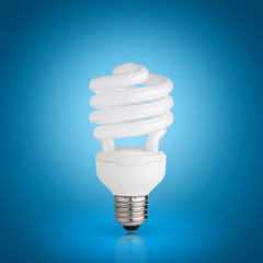 energy saving light bulb on blue background