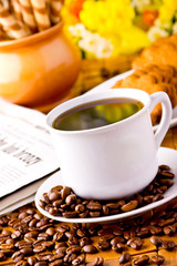 Coffee cup with fresh coffe beans for breakfast