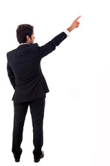 Young male business man pointing over white background