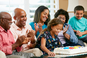 Multi Generation Family Celebrating Daughter's Birthday