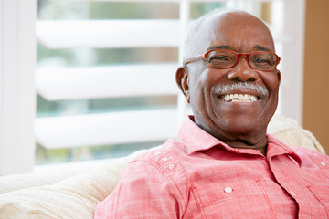 Portrait Of Happy Senior Man At Home