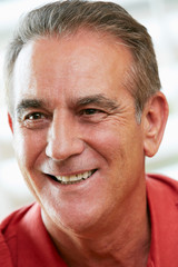 Portrait Of Happy Senior Man At Home