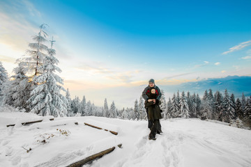 Fototapeta na wymiar Beautiful winter sunrise portrait of young tourists