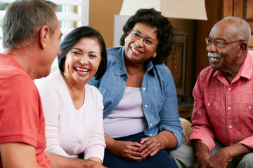 Group Of Senior Friends Chatting At Home Together - Powered by Adobe