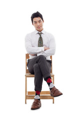 Young Asian business man sitting on the chair.