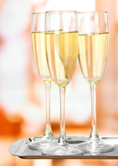 Corporate party: sparkling champagne glasses on tray