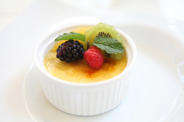 Creme brulee. Traditional French vanilla cream dessert with frui