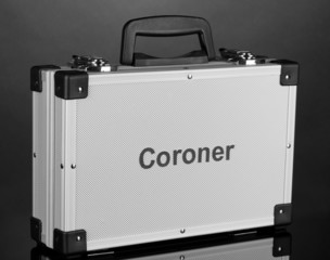 Silvery diplomat (suitcase) on grey background