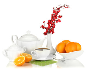 Beautiful white dinner service with oranges isolated on white