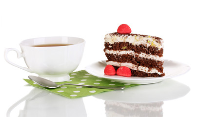 A cup of tea and delicious cake isolated on white