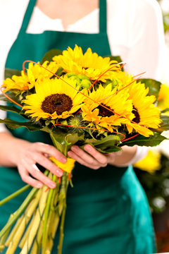 Woman holding bouquet sunflowers florist yellow flower