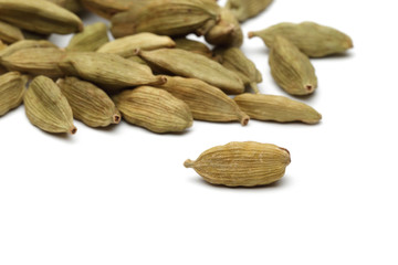 Cardamom seeds on a white background