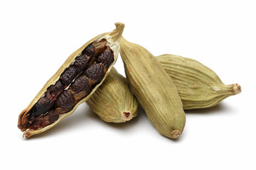 Cardamom seeds on a white background