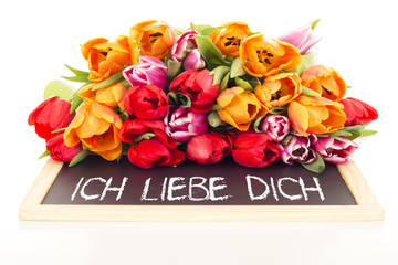 Bunch of tulips with blackboard: I love you