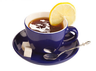 Blue teacup with sugar and lemon.