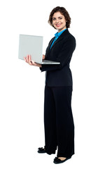 Business executive browsing on laptop