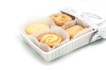 Assorted cookie in plastic box , isolated on white