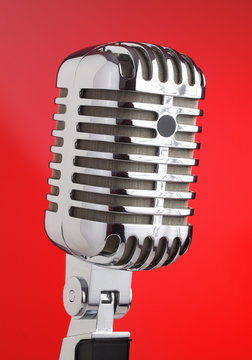 Microphone metal red background.