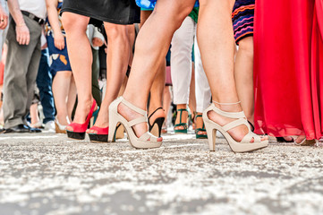 a lot of shoes in a lot of feet