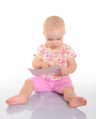 Baby playing with a picture on white background