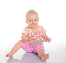 Baby playing with a picture on white background