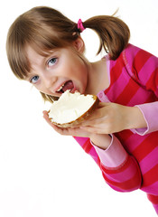 little girl eating a bread with cheese