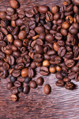 coffee beans on the background of mango wood. 