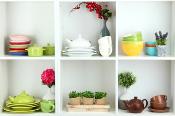 Beautiful white shelves with tableware and decor.