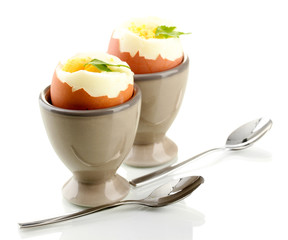 Boiled eggs in egg cup, isolated on white