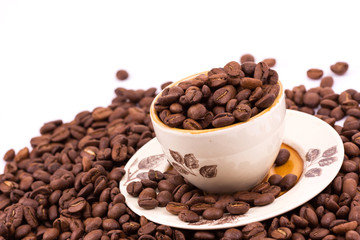 Coffee beans and cup of coffee background