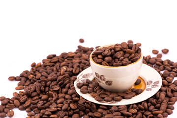 Coffee beans and cup of coffee background