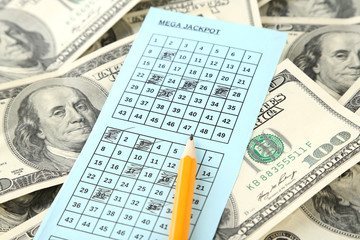 Obraz premium Lottery ticket, money and pencil, close up