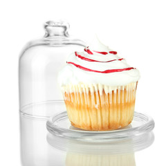 Cupcake on glass saucer, isolated on white
