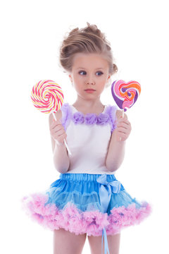 Little girl with two lollipops