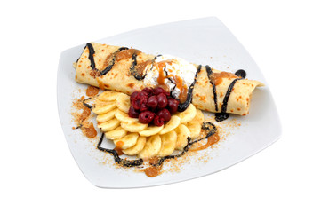 chocolate pancake with bananas and cherries